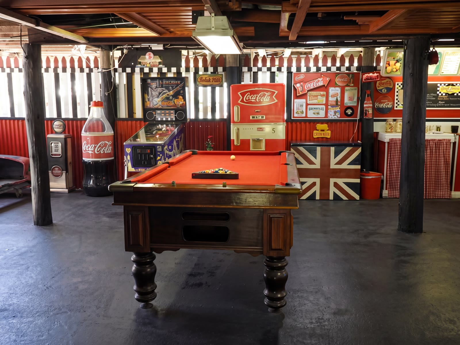 Red-felt pool table and pinball for a bit of fun