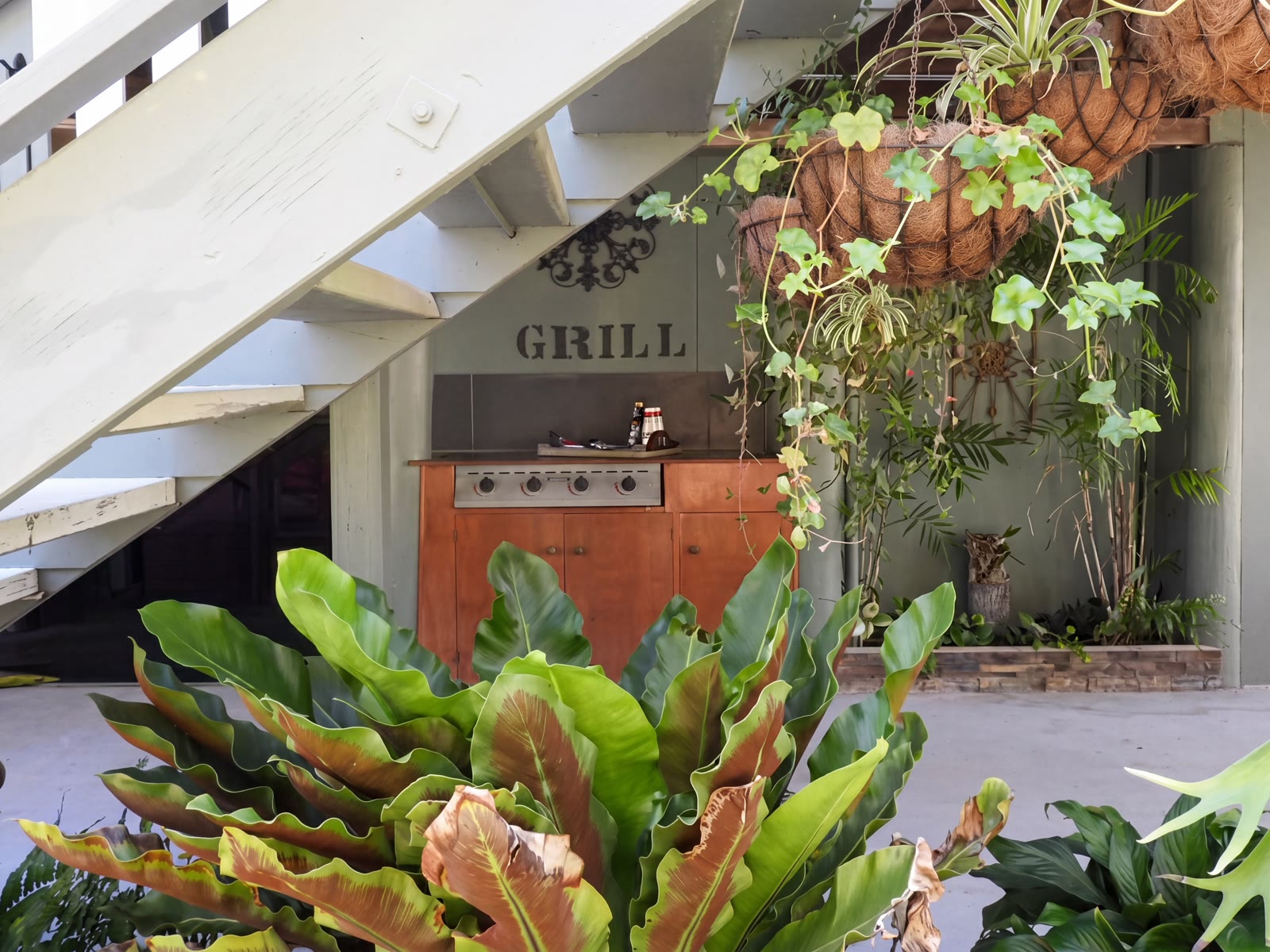 Tropical gardens and the retro 'Grill' frontage