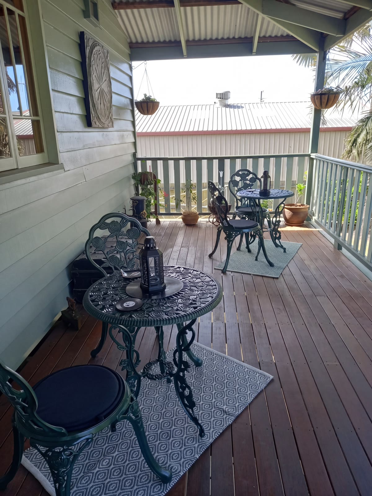 A wrought-iron bistro setting on the shady verandah